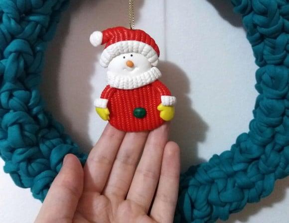 Guirlanda decorativa de natal , laço e boneco de neve