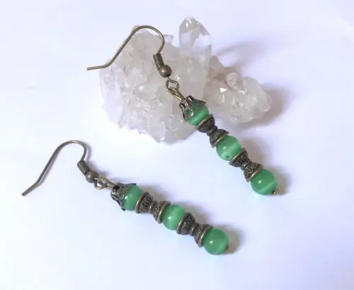 Brinco ouro velho com olho de verde