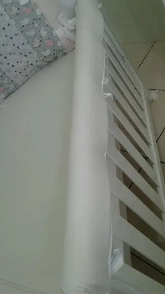 Protetor mordedor para a parte superior do berço