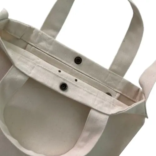 Bolsa em lona com alça transversal removível e ajustável