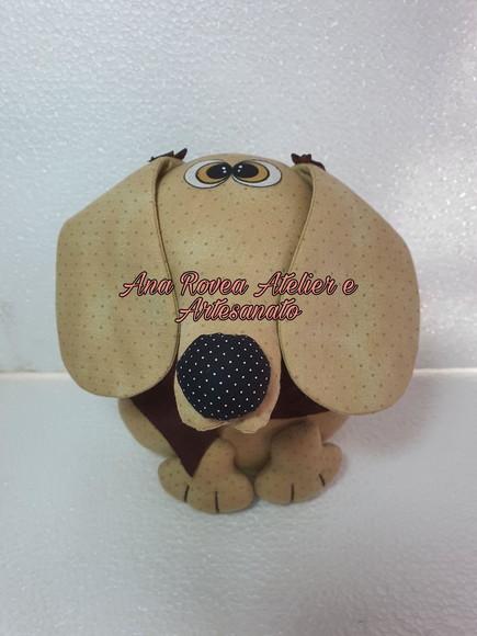 Cachorro peso de porta.