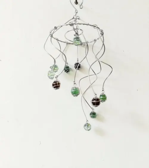 Suncatcher Turbilhão em tons de verde e âmbar