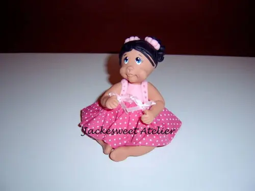 Boneca de vestido em biscuit