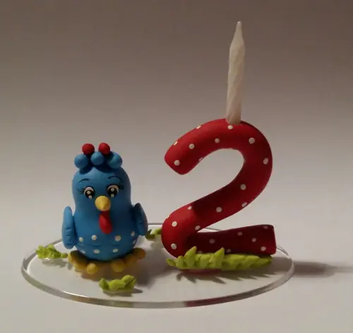 Topo com vela Galinha Pintadinha