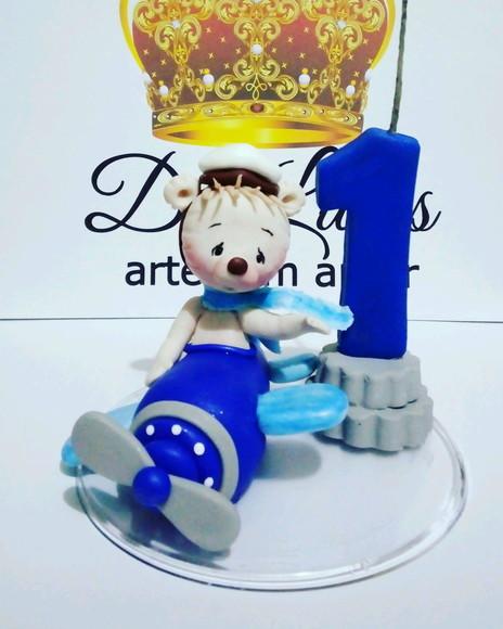 Vela com topo urso aviador