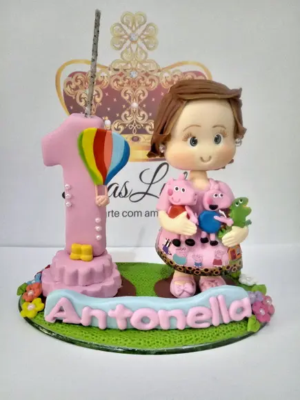 Vela porquinha com boneca