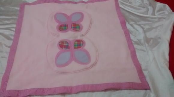 Manta de bebê que transforma em almofada