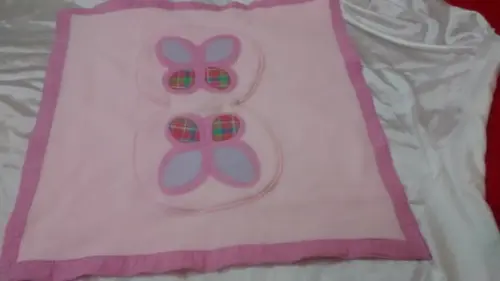 Manta de bebê que transforma em almofada