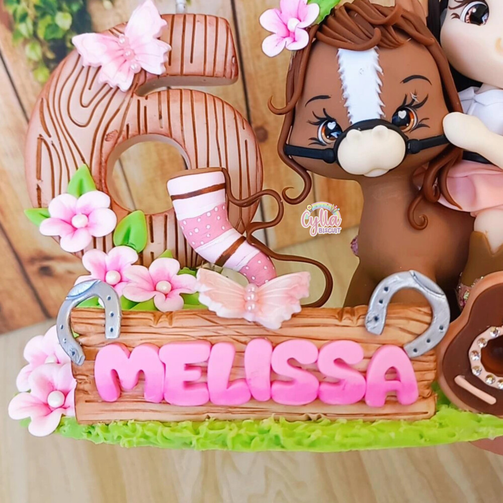 Vela topo de bolo boiadeira em biscuit