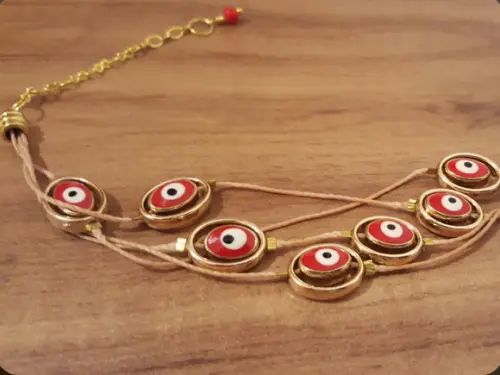 Pulseira de Olho Grego com Fios Encerados