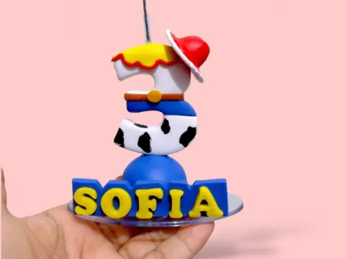 Vela tema brinquedos cowboy menina em biscuit