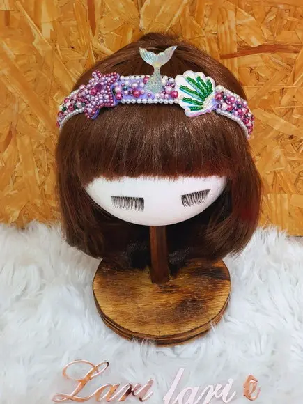 Arial tiara infatil