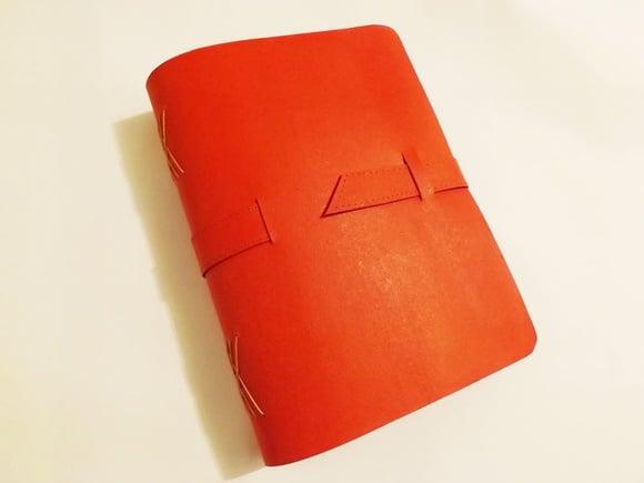 Agenda/caderno em recouro vermelho