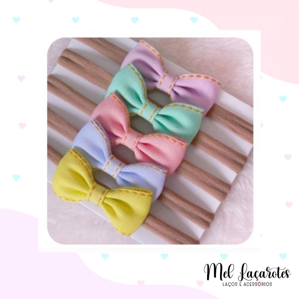 Kit com 5 lacinhos gravatinha jeans na faixinha de bebê