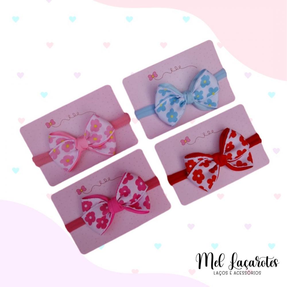 Laço Bella com estampa de flor na faixinha/ a unidade