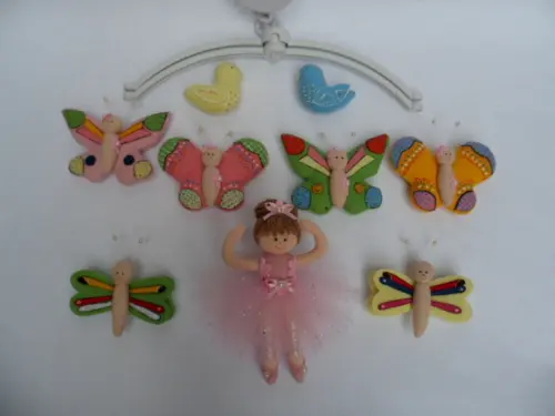 Móbile de berço musical menina.