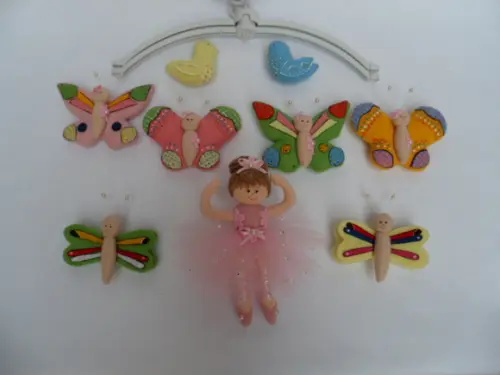 Móbile de berço musical menina.