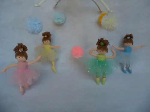 Móbile de berço musical menina.