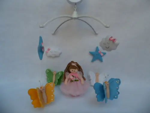 Móbile de berço musical menina.