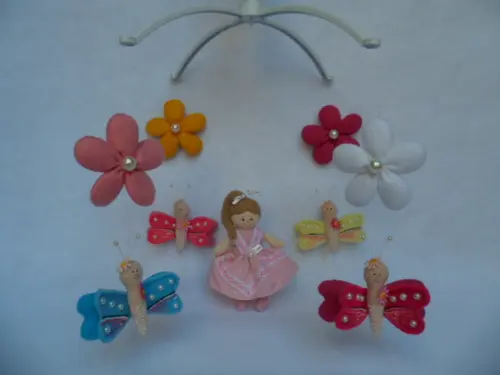Móbile de berço musical menina.