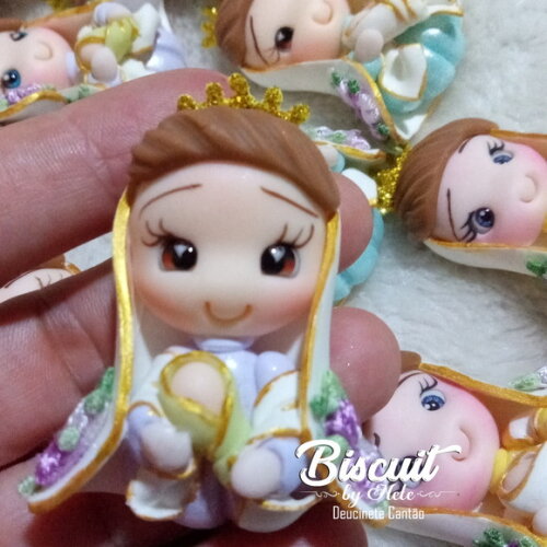 Apliques Nossa Senhora de Nazaré em Biscuit
