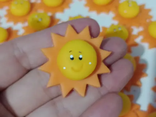 Aplique Solzinho de Biscuit com Dez Peças