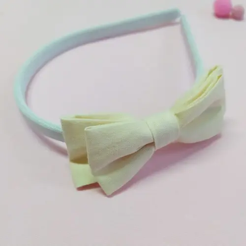 Tiara com Laço Borboleta Duplo Creme