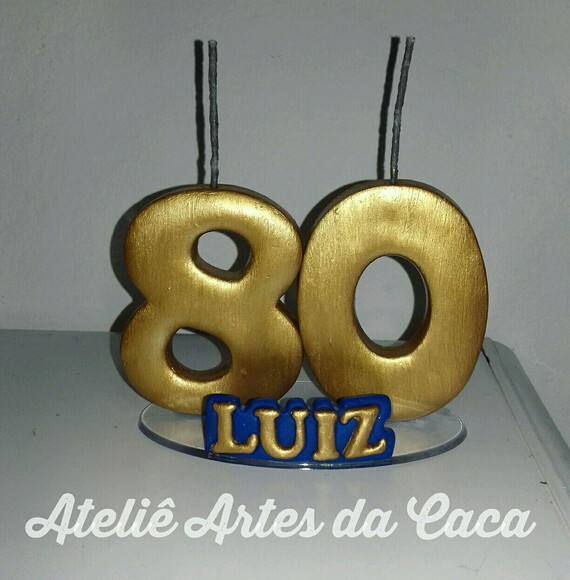 Vela dourada com nome
