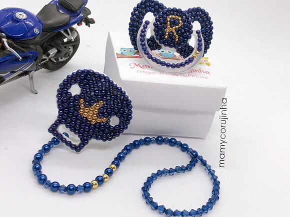 Chupeta azul marinho e dourada