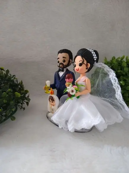 Casal de noivinhos com nossa senhora de Fátima