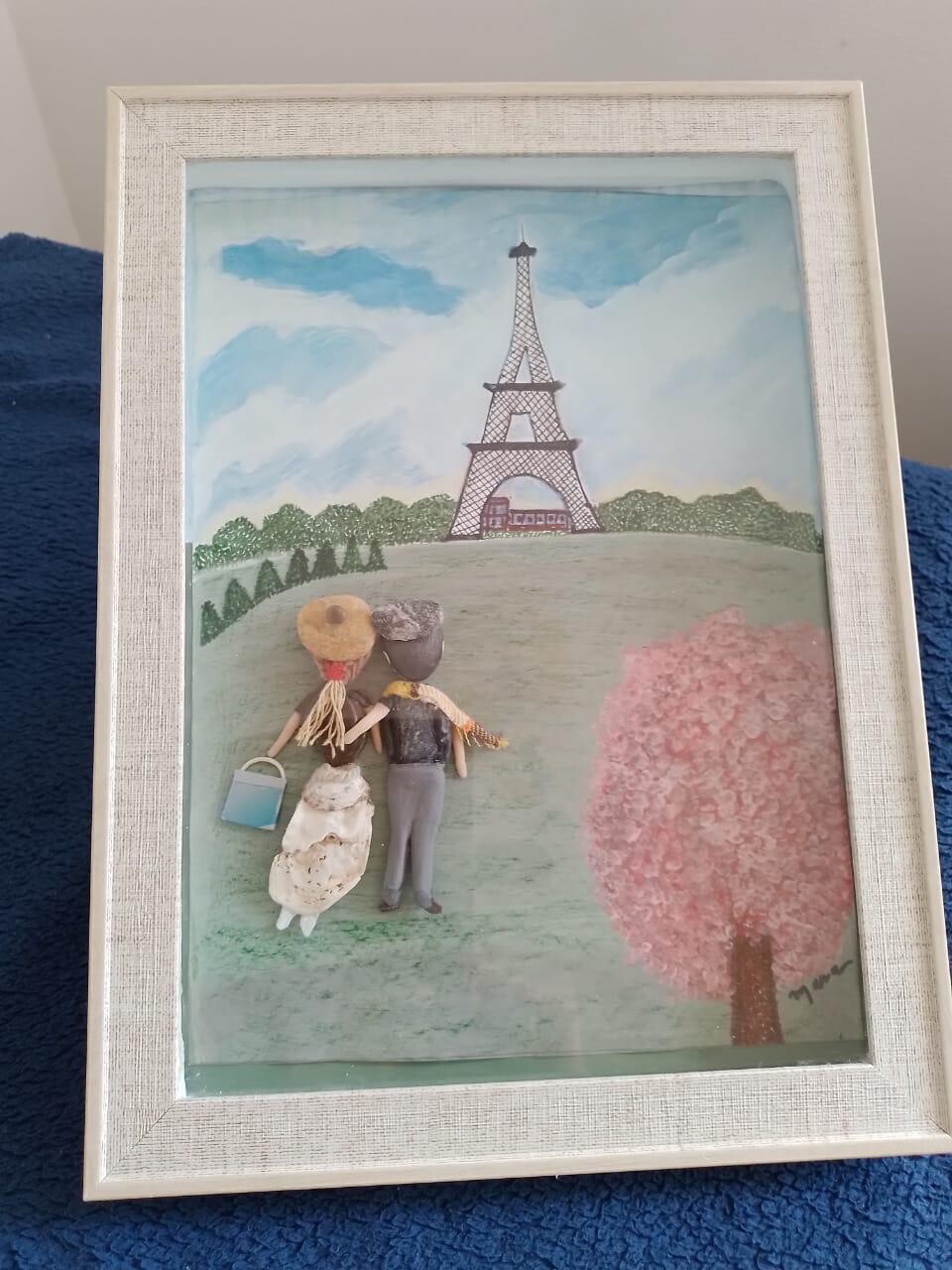Quadro feito de pedras e conchas Casal em Paris