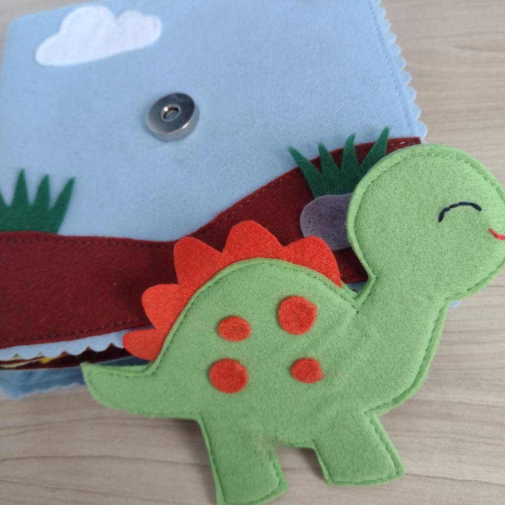 Livro sensorial do dinossauro em feltro para crianças