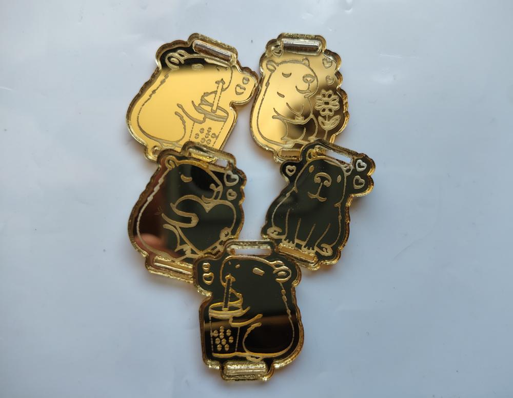 Kit 25 Passantes de Elástico Chato Capivara em Acrílico Dourado