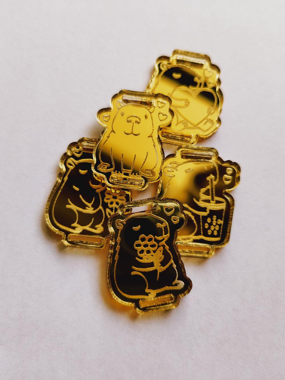 Kit 25 Passantes de Elástico Chato Capivara em Acrílico Dourado