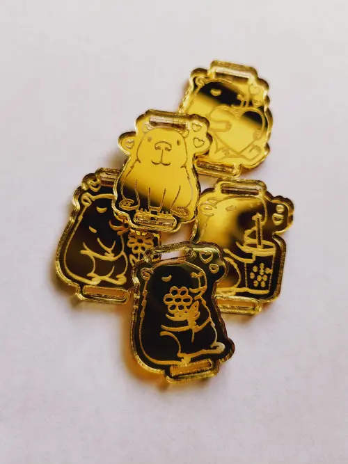 Kit 25 Passantes de Elástico Chato Capivara em Acrílico Dourado