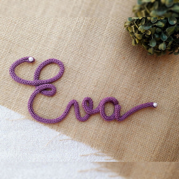 Eva em Tricotin (valor Refere-se ao Nome)