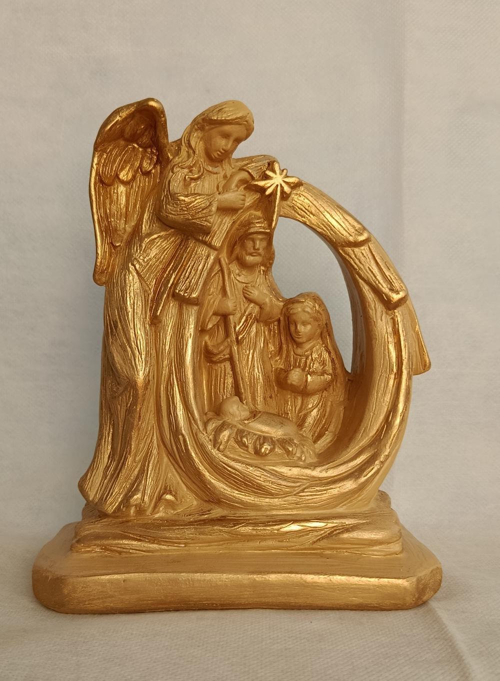 Presépio - família sob o anjo