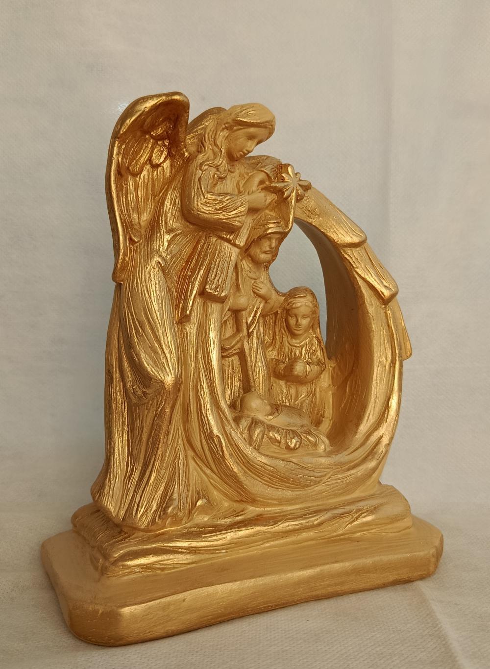 Presépio - família sob o anjo