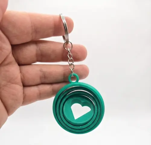Chaveiro Fidget Coração Giratório - Presente Criativo Dia dos