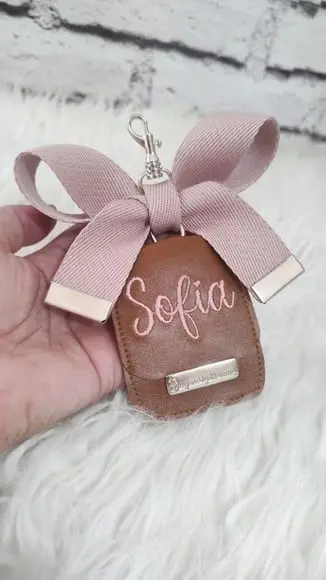 Chaveiro com Laço Bolsa Maternidade Caramelo e Rose